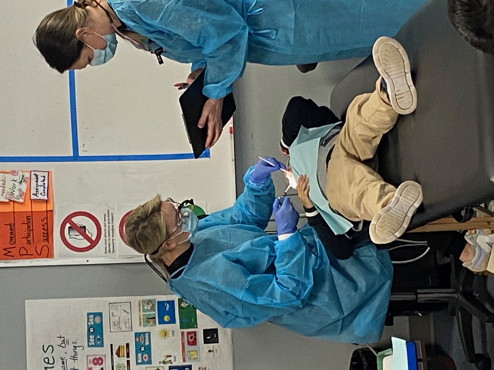 dental staff with a student